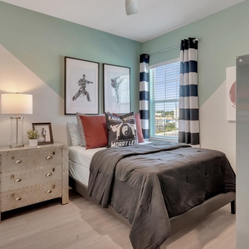 Relax and recharge in beautiful and spacious bedrooms a bedroom with a bed and a window
